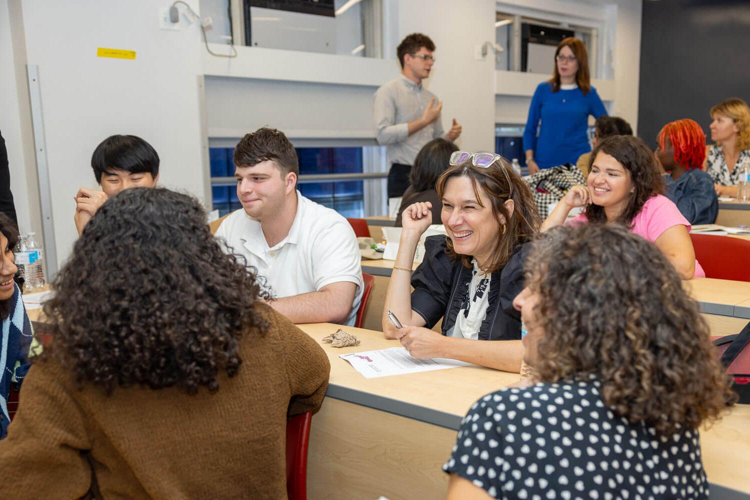 Faculty director of the Tow Mentorship Tammy Lewis meets with students at the kickoff of the Tow Mentorship Initiative.